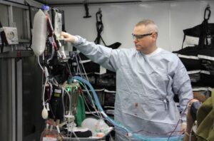 Maj. Adam Faltersack using prototype A of the tactical anesthesia workstation, or TAW, during a Ground Surgical Team, or GST, training course.