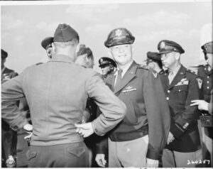 General Hap Arnold standing amongst colleagues