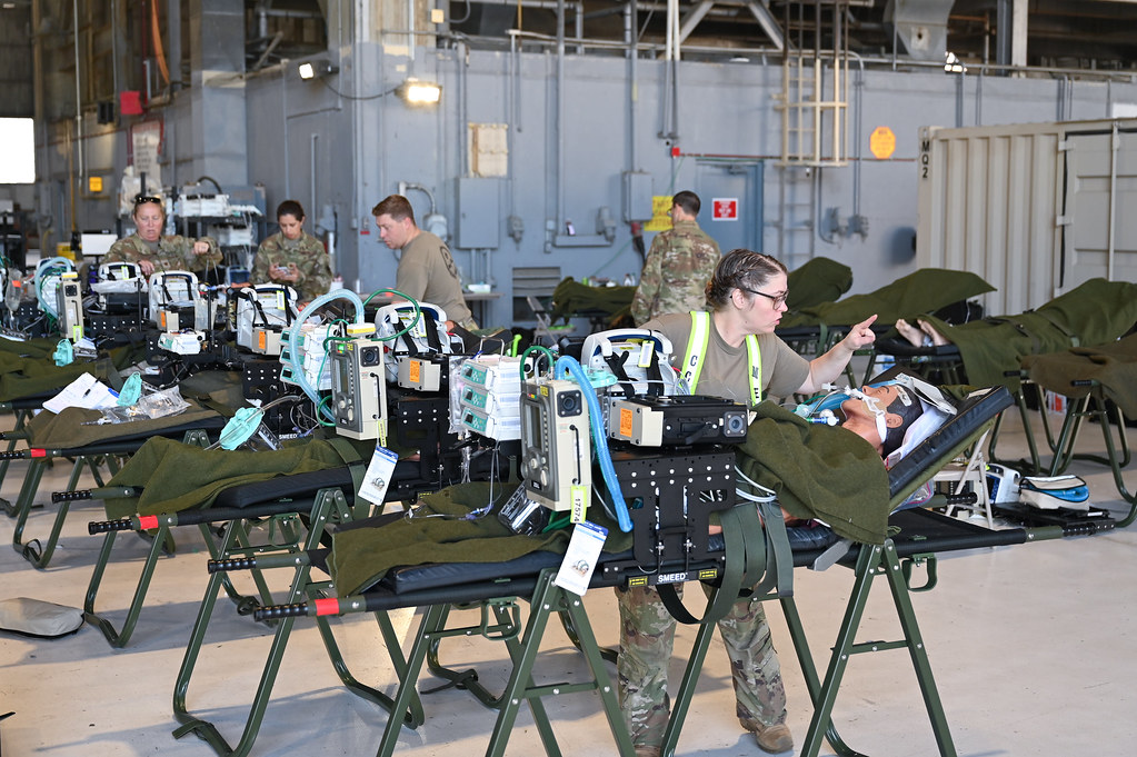 medical personnel working on test dummies during training exercises