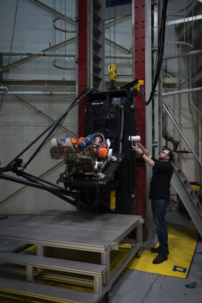 The vertical deceleration tower at Wright-Patterson Air Force Base with a U.S. Air Force volunteer strapped in testing a new space suit and seat combo for upcoming Orion spacecraft missions.