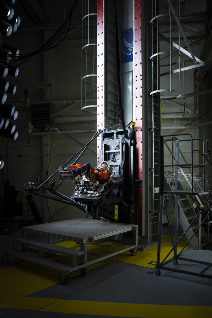 The vertical deceleration tower at Wright-Patterson Air Force Base with a U.S. Air Force volunteer strapped in testing a new space suit and seat combo for upcoming Orion spacecraft missions.