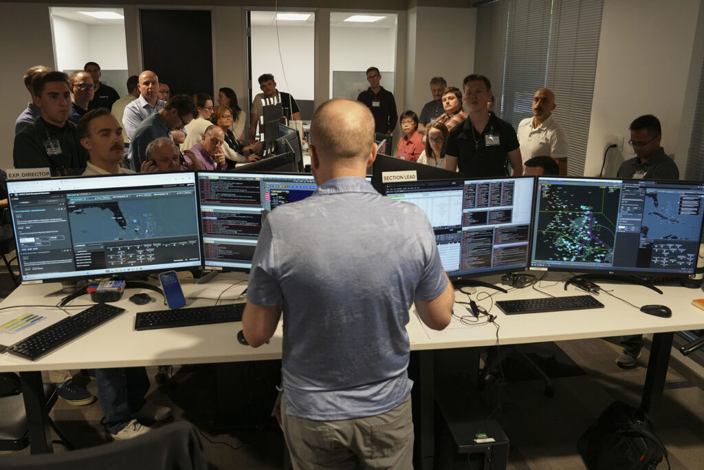 attendees listen in on presentation of MASH experiment