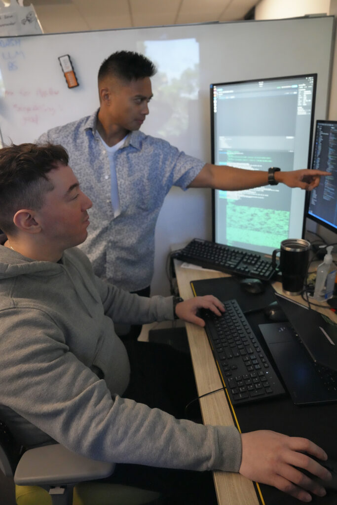 Airmen in attendance of MASH experiment present various aspects of software to attendees