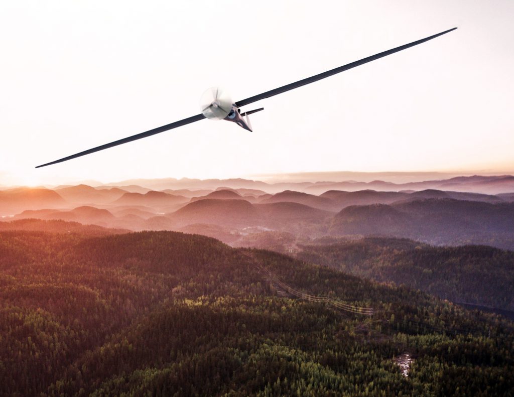 image of glider over mountains