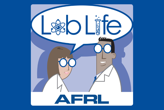 Lab Life Podcast logo showcasing a woman in a lab coat and glasses to the left of a man in a lab coat and glasses. The words Lab Life are being spoken by the woman scientist.