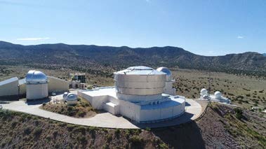 image of research facility with mountains in the background