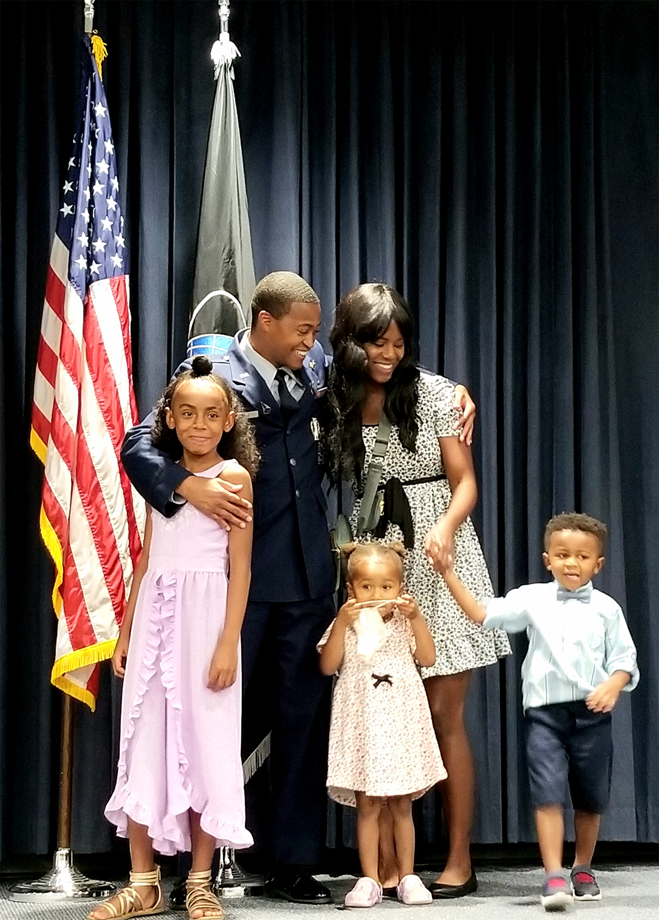 image of officer and family
