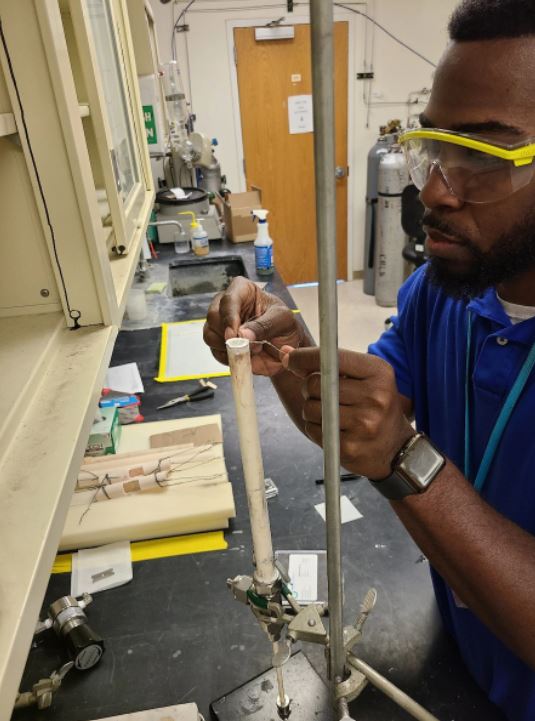 Dr. Andre Spears assembling the solid oxide fuel cell for testing as part of the Bipropellant Enabled Electrical Power Supply.