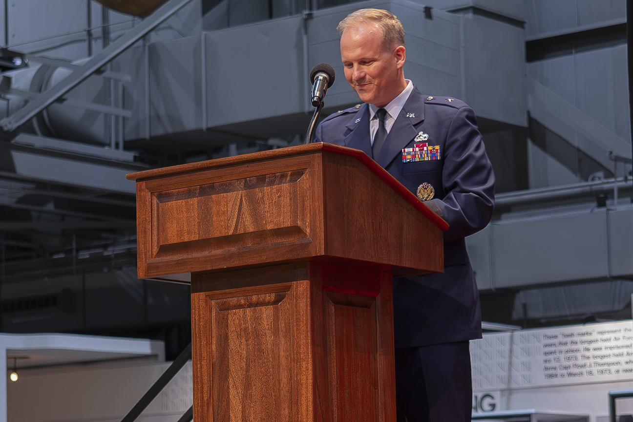 new commander speaking to crown during ceremony