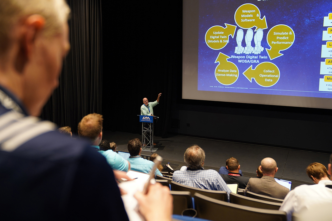 speaker presenting slides during collider event