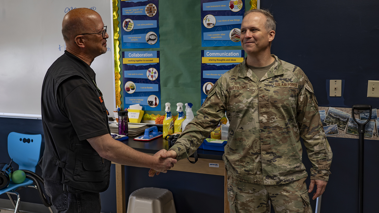 AFRL Commander shaking hands with STARBASE program director