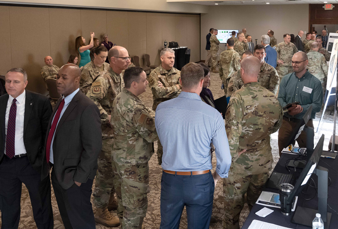 conference attendees examining presentations feature image