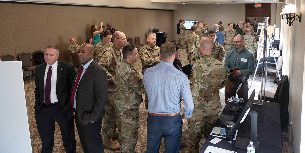 attendees examining presentations