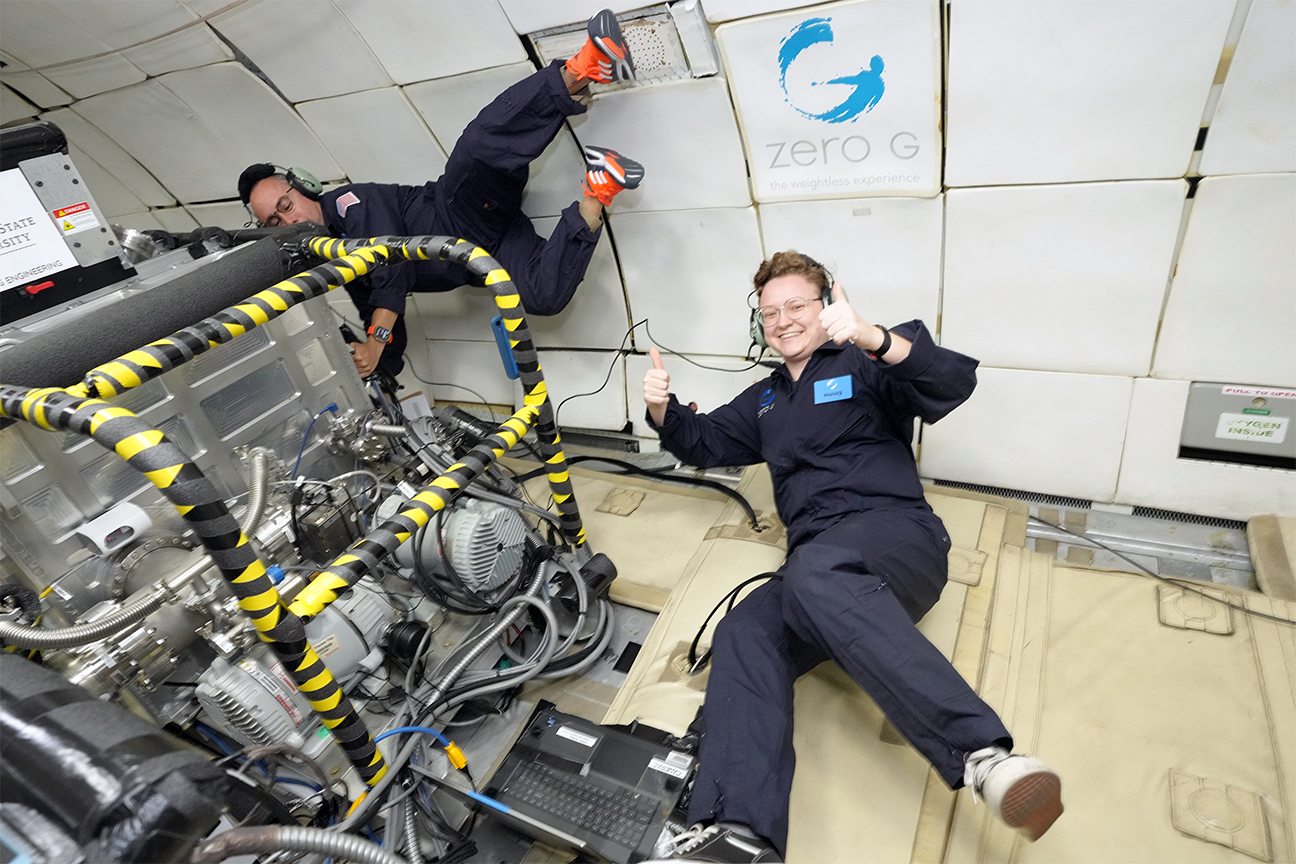 team of engineers floating while testing for space laser welding