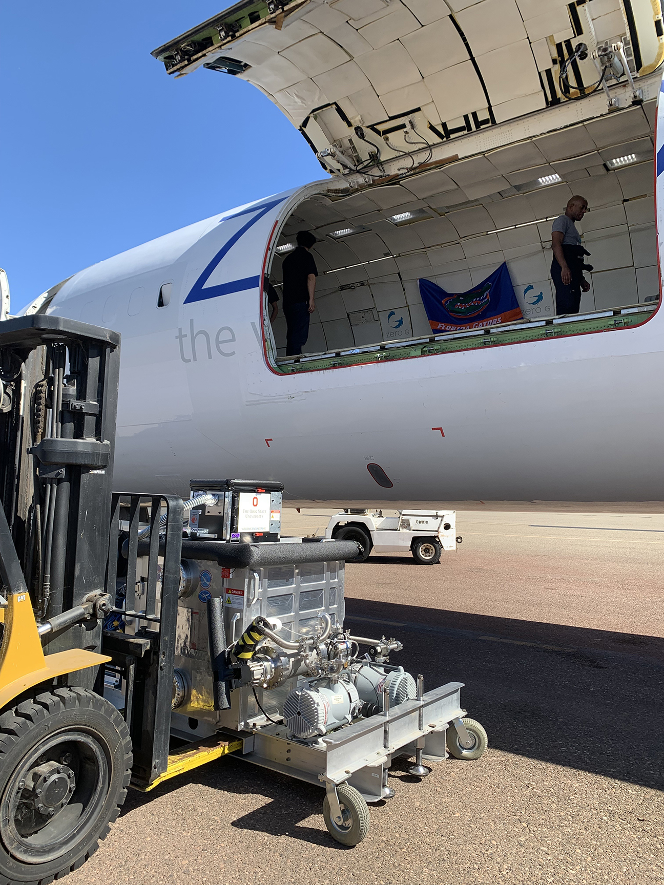 laser welding system being loaded onto airplane