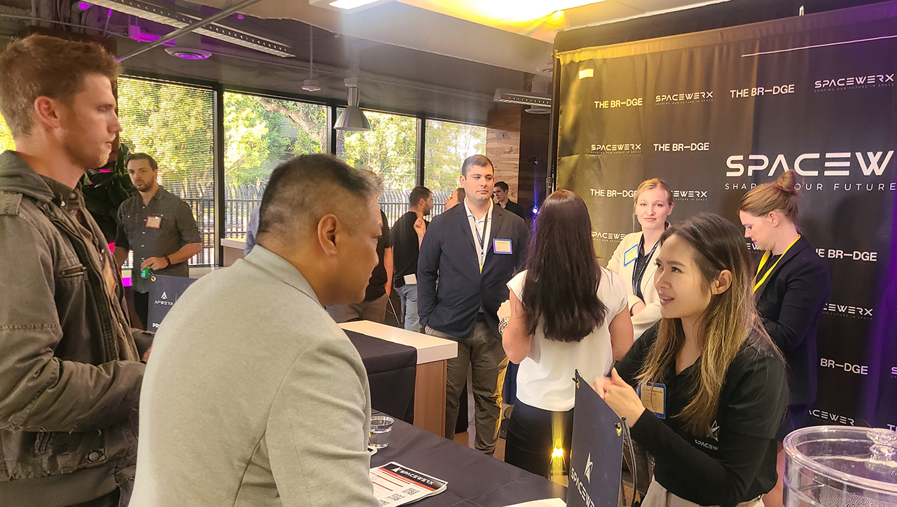 presenter engaging with visitors during event