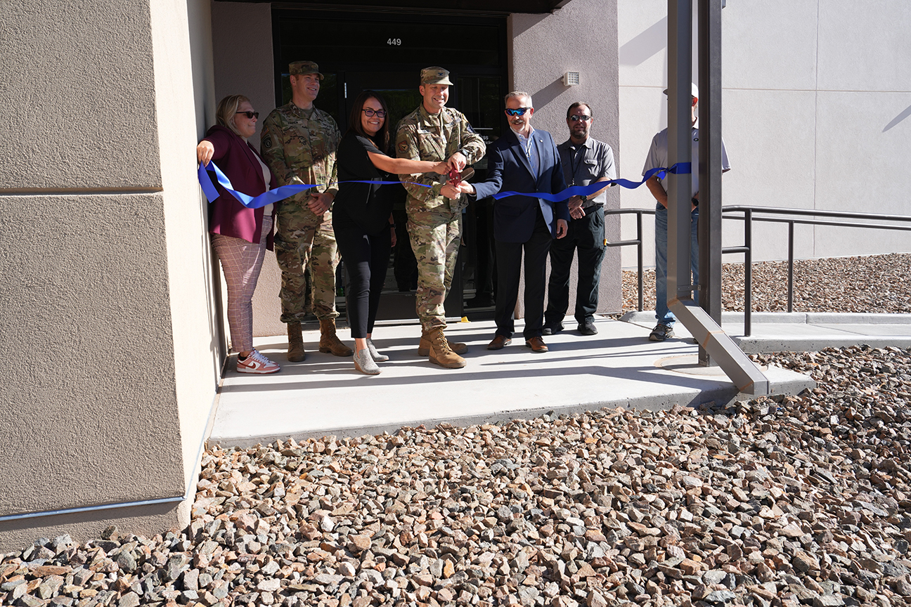 ceremony attendees perform ribbon-cutting