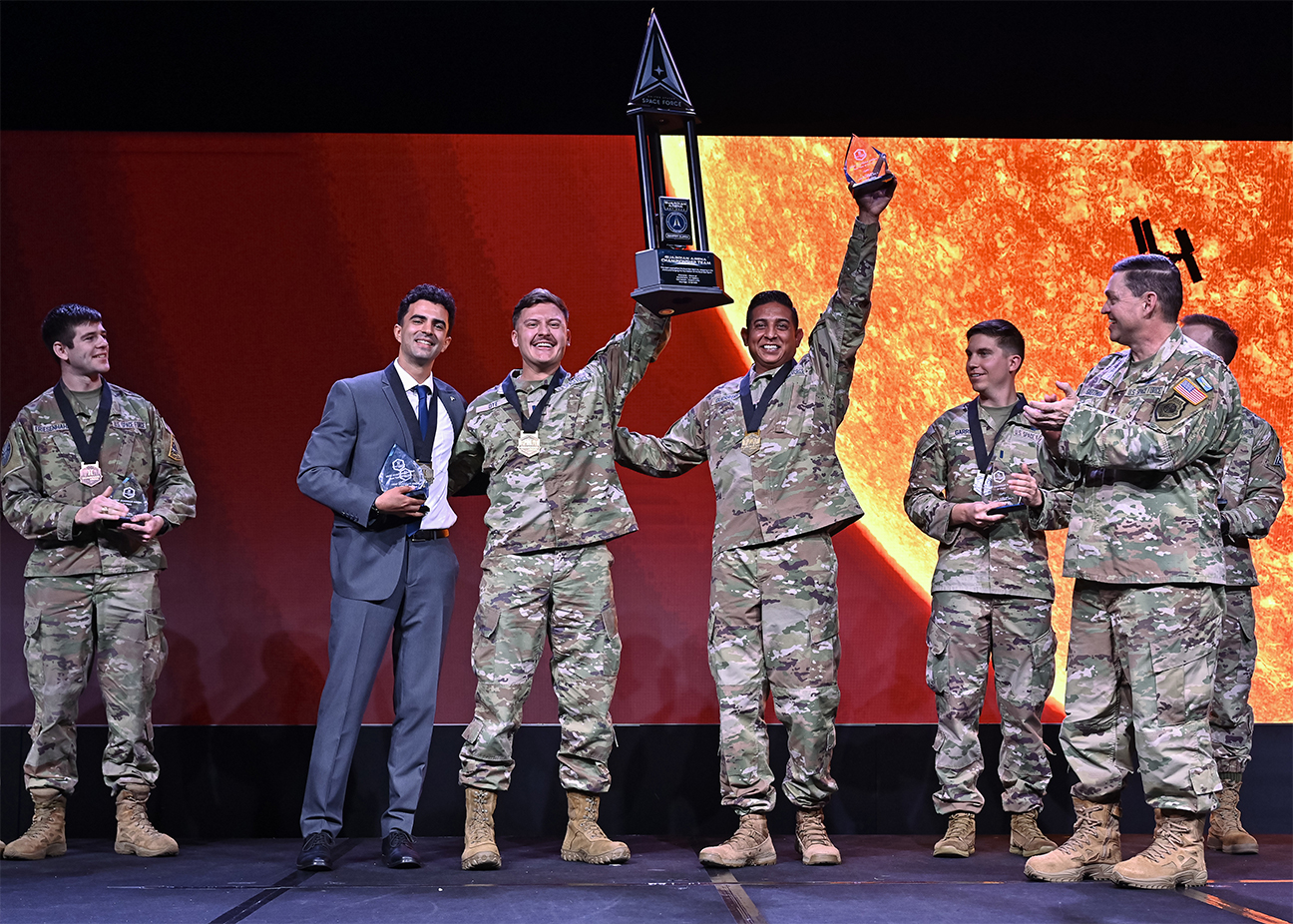 winning team receiving trophy at event