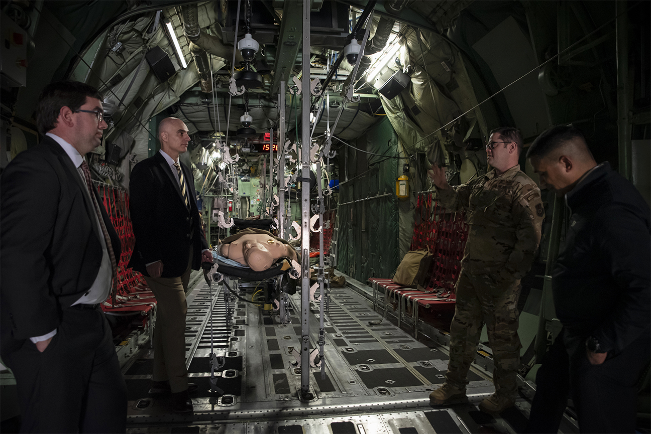 leaders standing in cargo plane training simulator