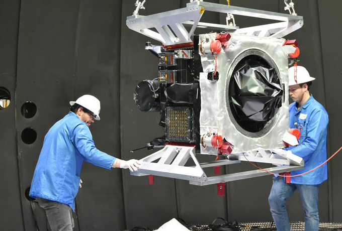 Oracle-M fire test equipment being maneuvered by technicians