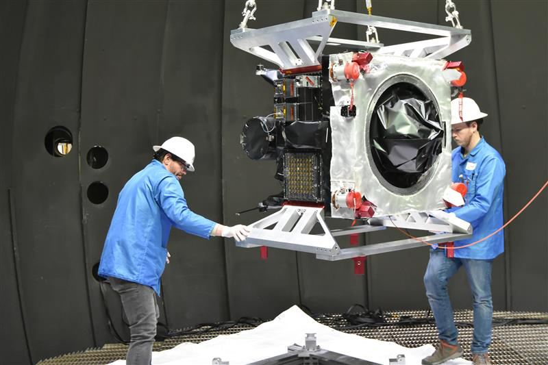 technicians maneuvering test equipment