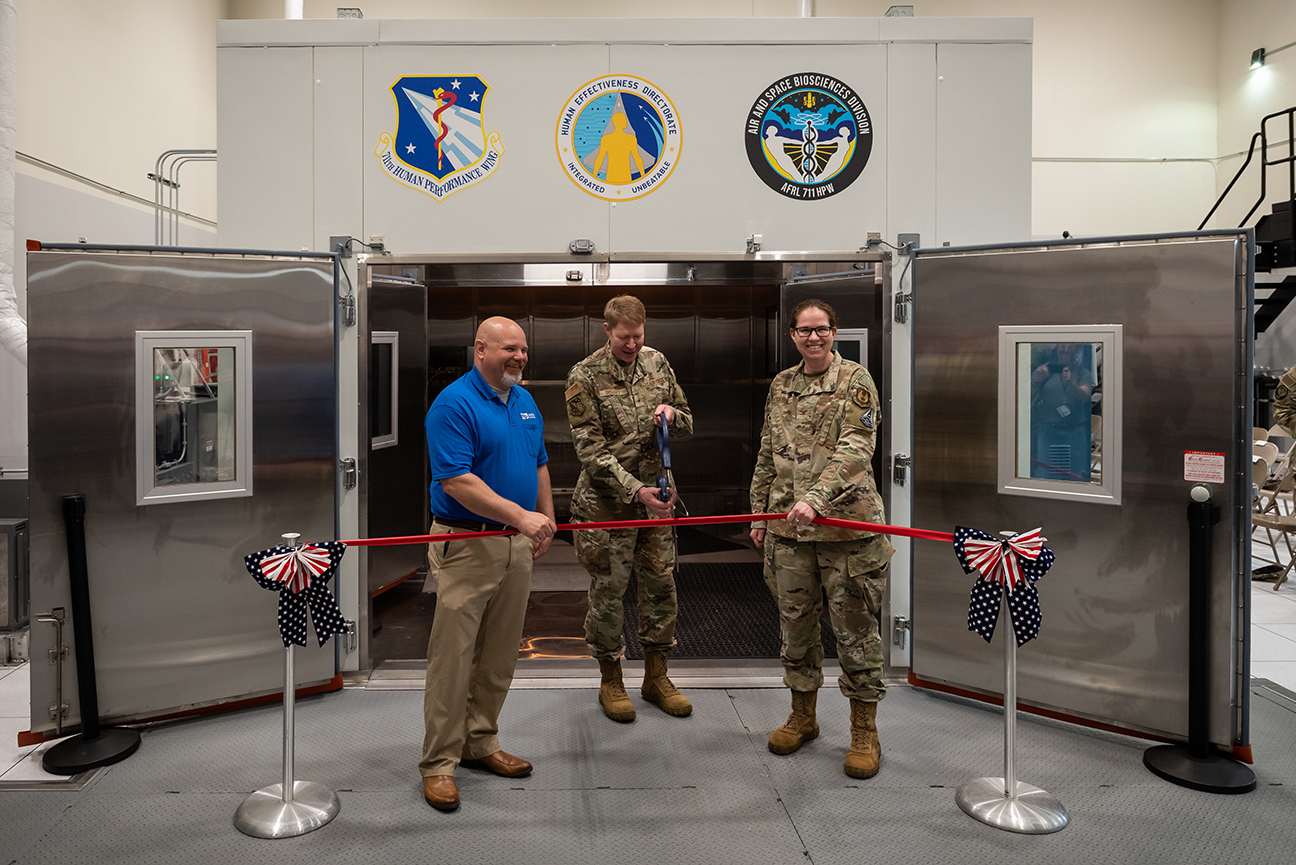 leadership cutting ribbon during ceremony