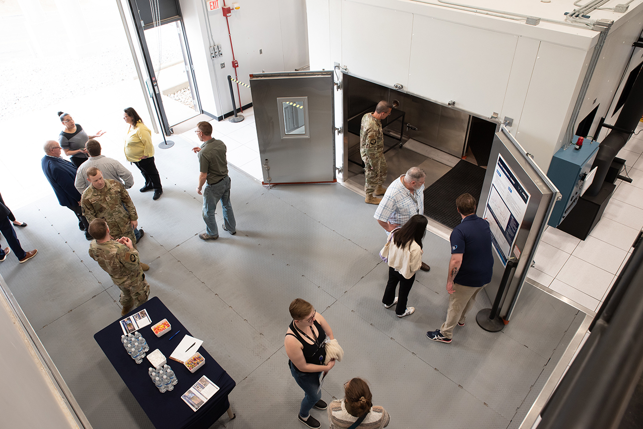 attendees examining REC facility