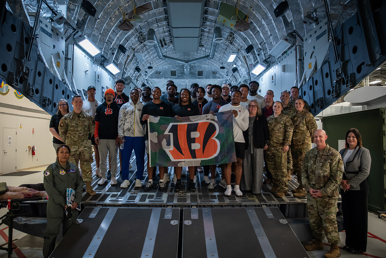 Bengals rookies and airmen tour training simulator of C-17 aircraft