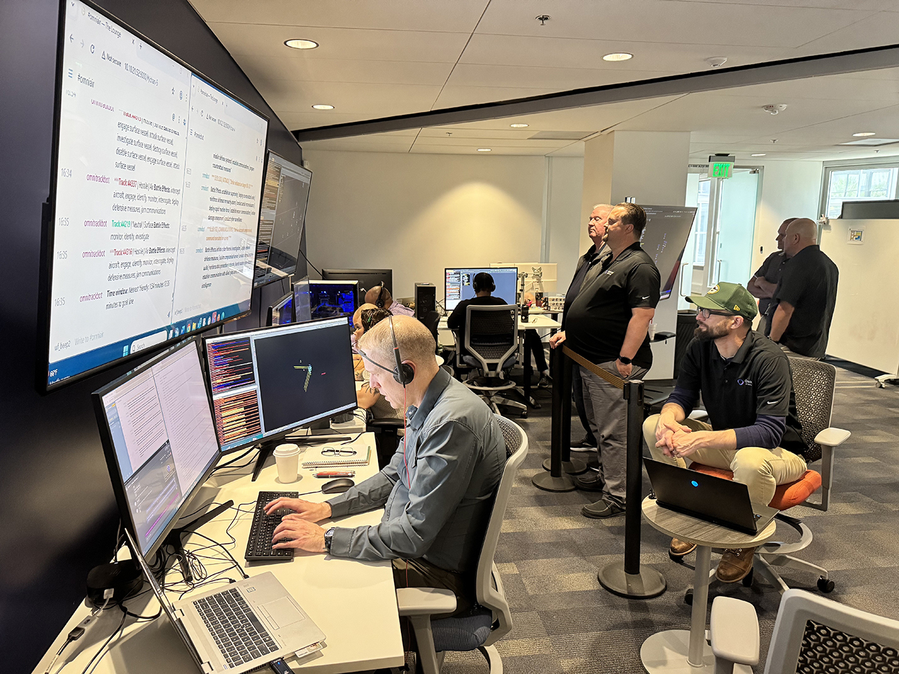 attendees watch DASH presentation during event