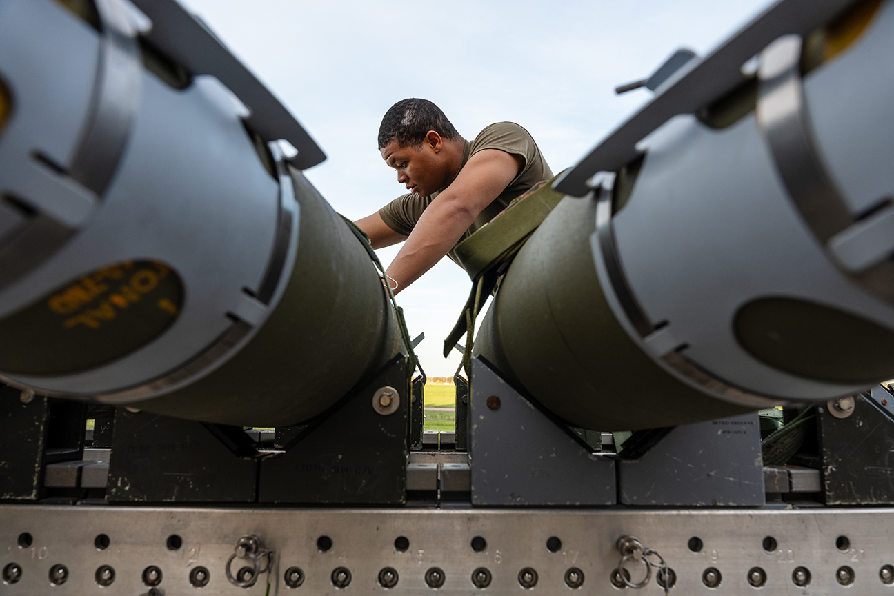 airman prepares slealth bomber with QUICKSINK munitions