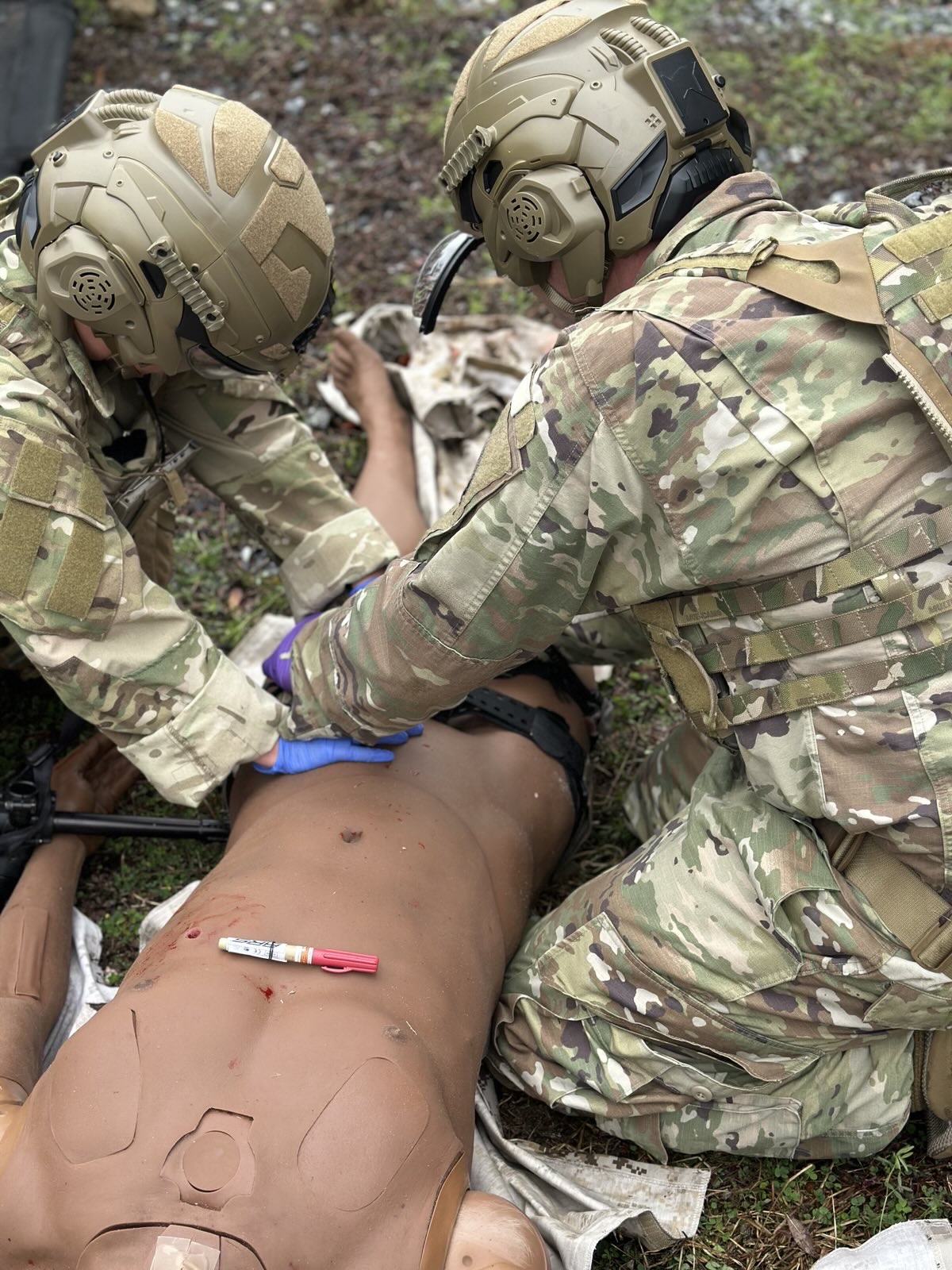 airmen participate in skills development training with mannequin